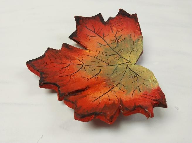 Clay molded in the shape of a maple leaf