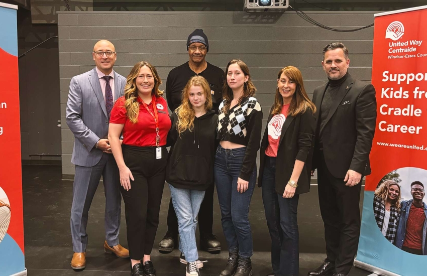 United Way representatives join St. Clair College administrators, faculty, and students on stage