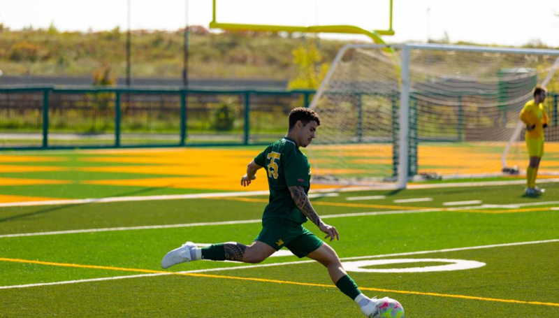 Frederico Colares winding up for kick on soccer field
