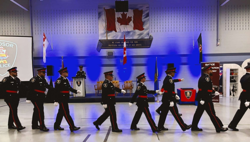 Newly badged Windsor Police officers march