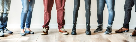 Image of 6 people from just above the knee, down.