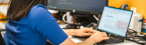 Woman typing on computer