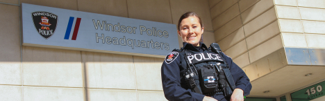 Windsor Police Service officer out front of headquarters