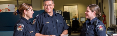 3 Brantford police officers talking in lobby